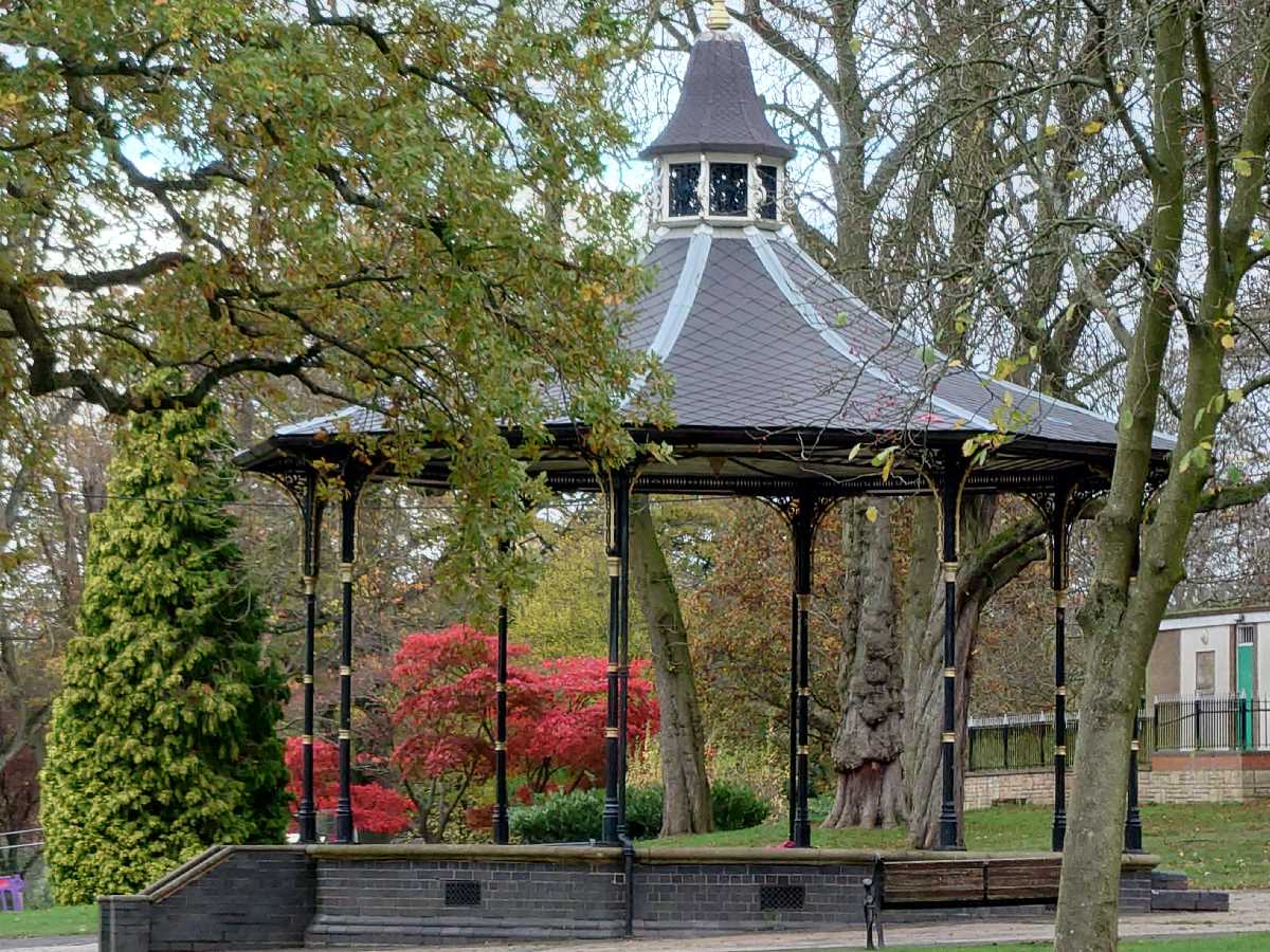 Red leafed trees behind the Bandstand at Cannon Hill Park - 8th November 2022